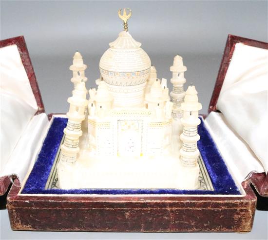 6 various boxes and a model of the Taj Mahal